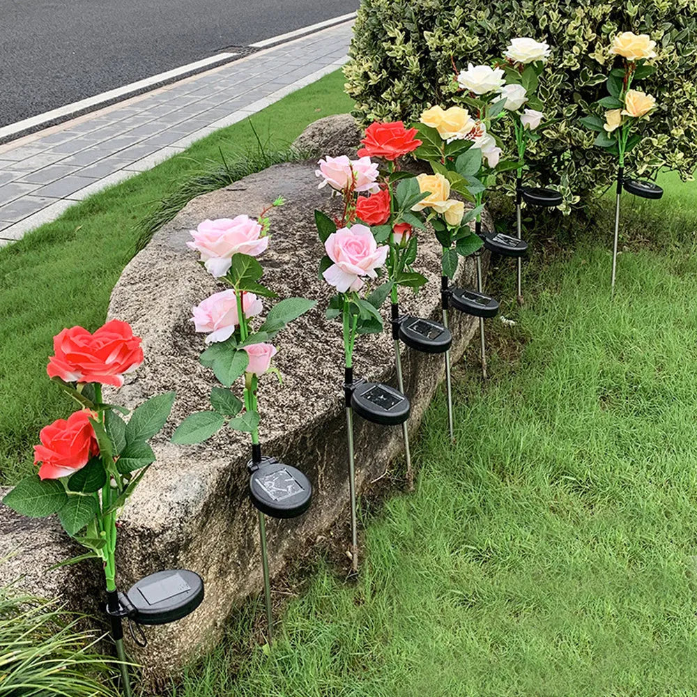 Three-headed solar rose garden light with ground spike and white LED illumination