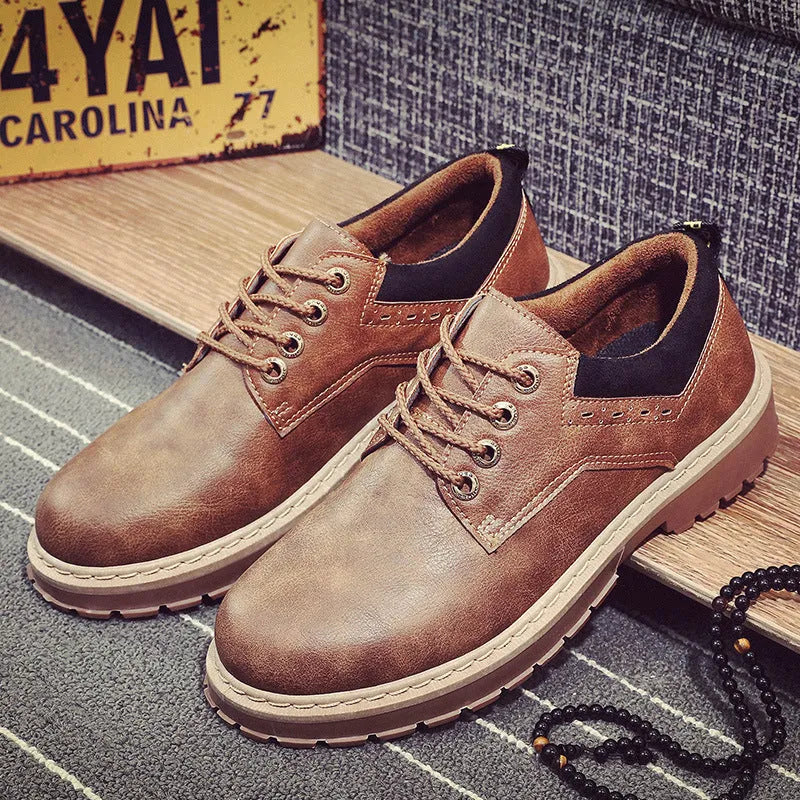 Men's black casual tooling shoes with round toe and front-tie closure on rubber sole