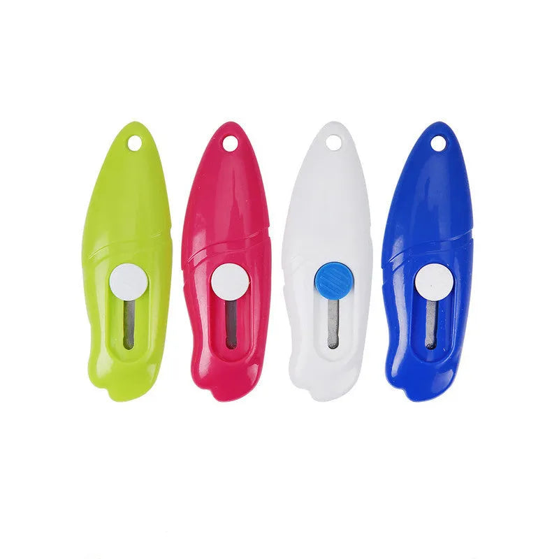 Cartoon art knife with plastic and metal construction for manual craft cutting