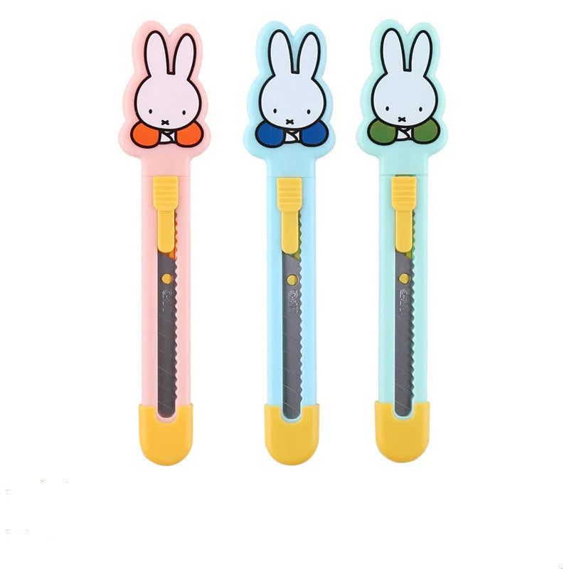 Cartoon art knife with plastic and metal construction for manual craft cutting