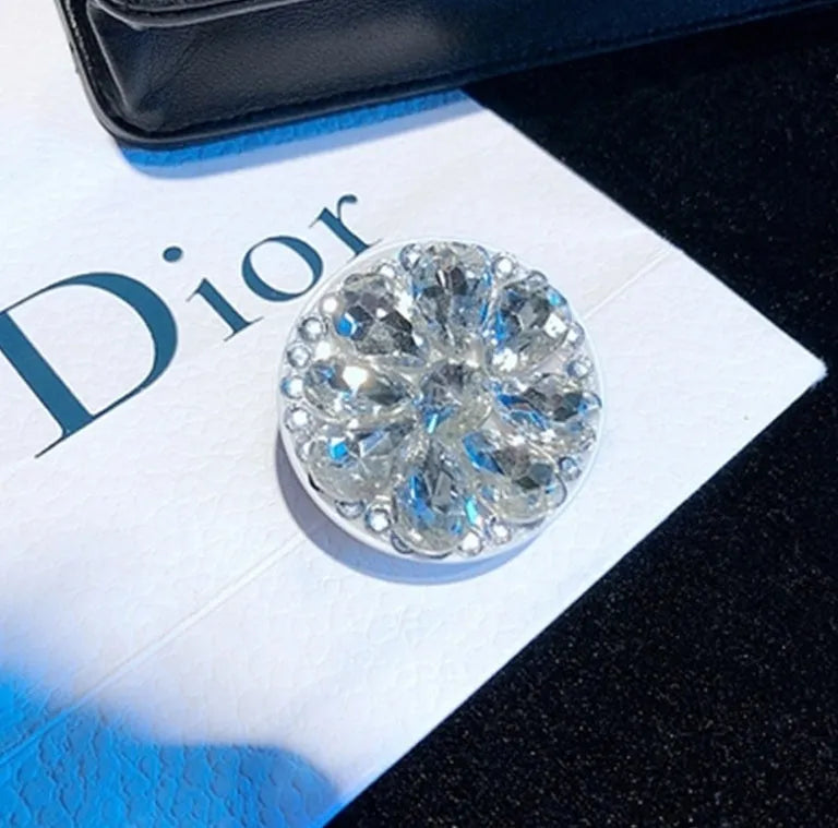 Rhinestone airbag mobile phone holder with telescopic bracket, shown in one of seven colour options for hands-free viewing.