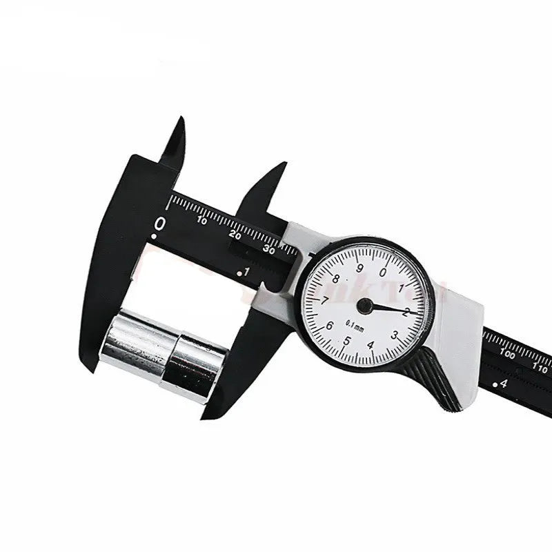 Black and white plastic vernier caliper showing 0-150mm measurement scale with 0.1mm graduation markings