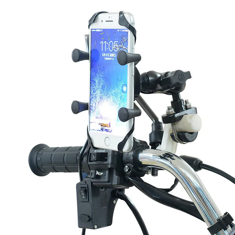 Black aluminium motorcycle phone mounting bracket installed on a handlebar, holding a mobile phone.