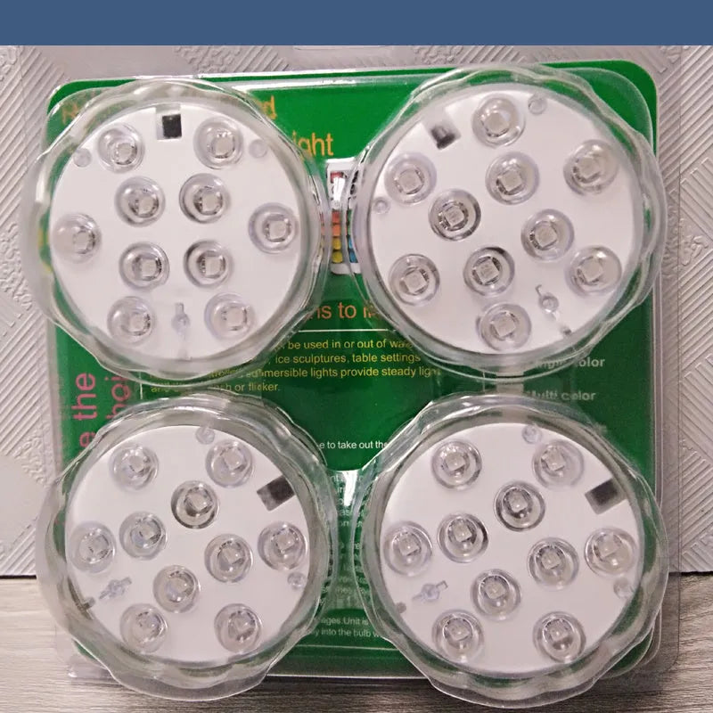 White waterproof LED disc light with remote control for pools and gardens.
