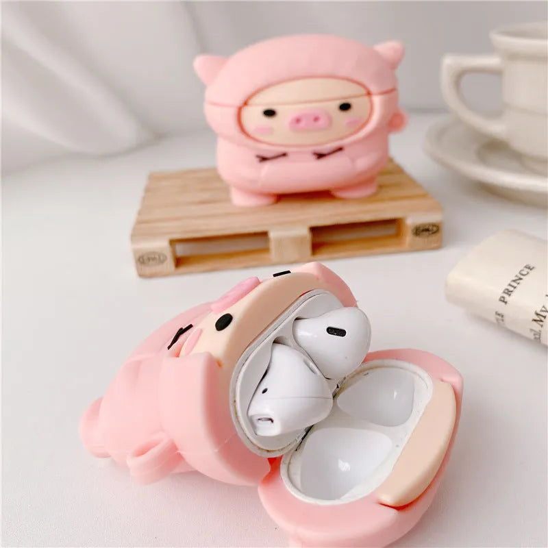Pink cartoon pig design silicone flip case for Apple AirPods with an attached metal carrying hook.