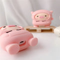 Pink cartoon pig design silicone flip case for Apple AirPods with an attached metal carrying hook.