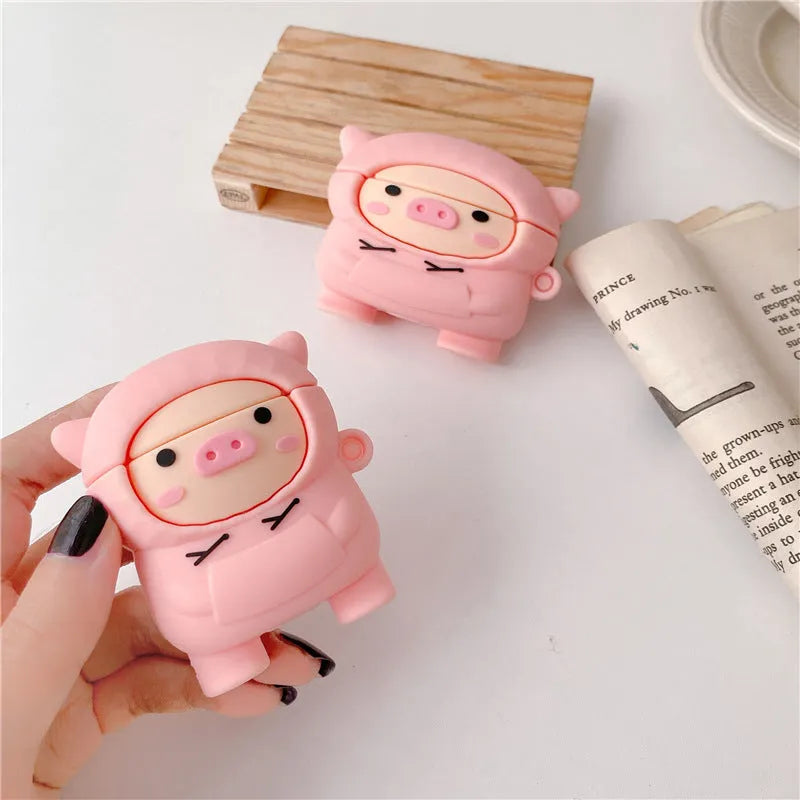 Pink cartoon pig design silicone flip case for Apple AirPods with an attached metal carrying hook.