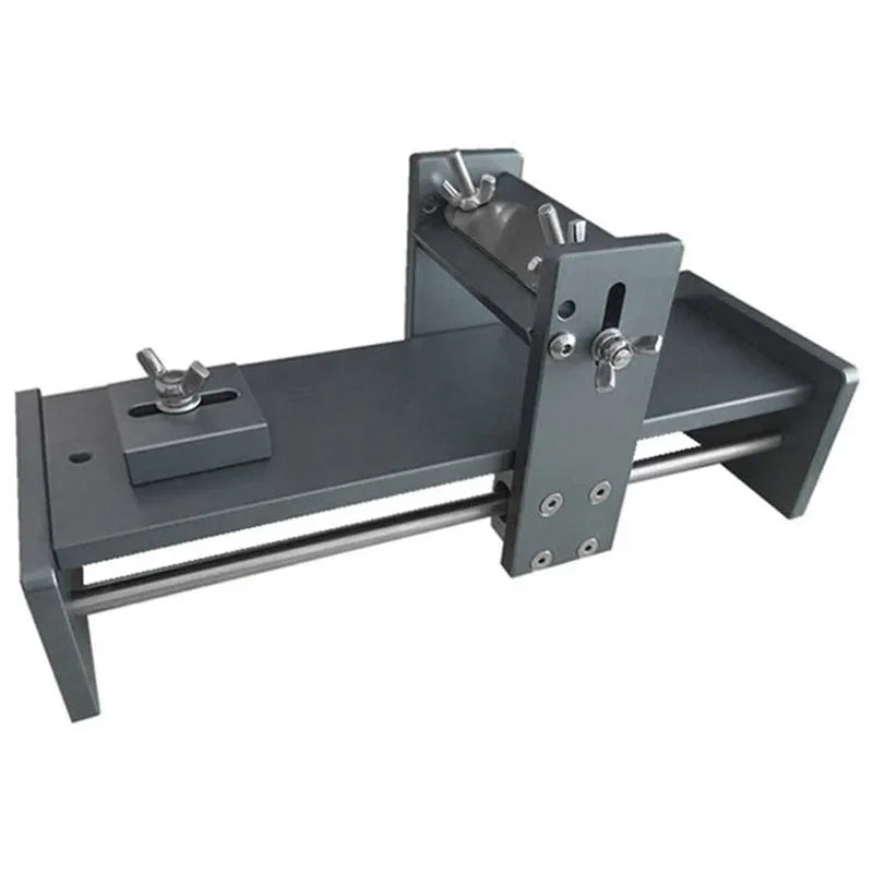Aluminium alloy fixed angle sharpening tool for woodworking chisels and carving knives on a workbench.