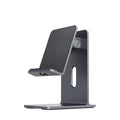 Dark space grey alloy mobile phone holder with lazy bracket on a desktop.
