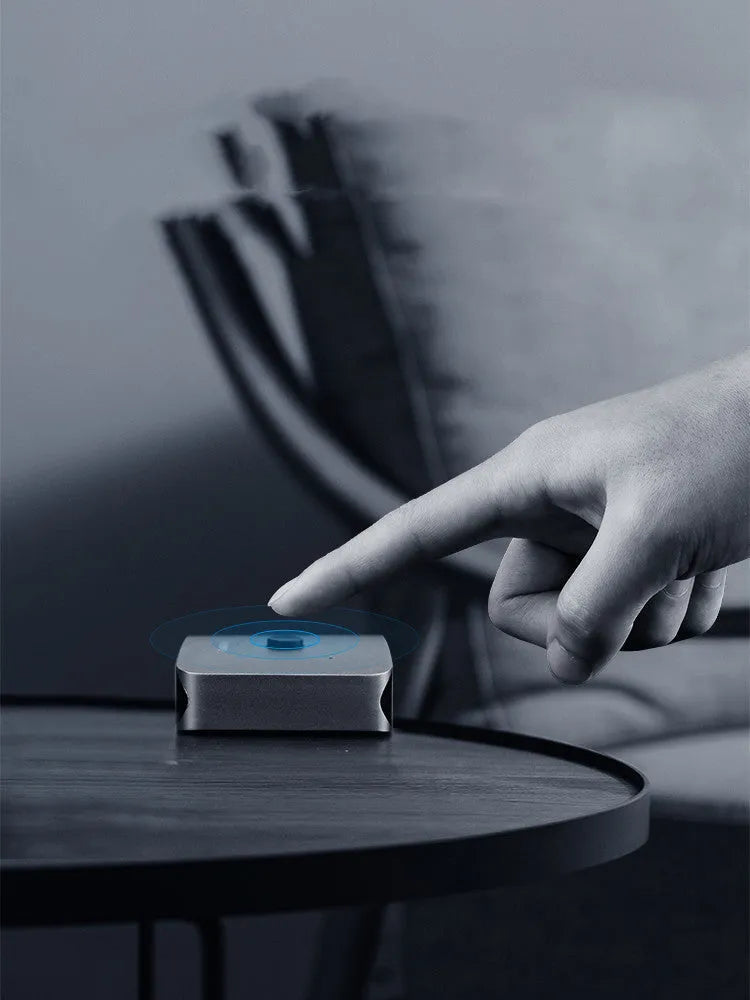 Grey HDMI switcher with one input and two output ports for 4K video sharing between displays