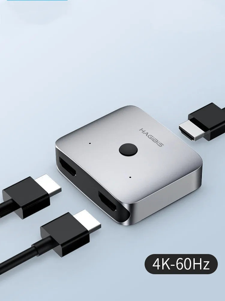 Grey HDMI switcher with one input and two output ports for 4K video sharing between displays
