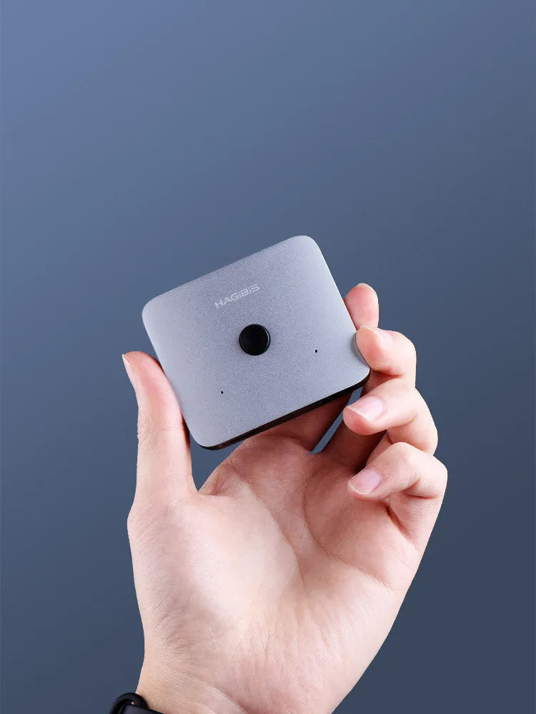 Grey HDMI switcher with one input and two output ports for 4K video sharing between displays