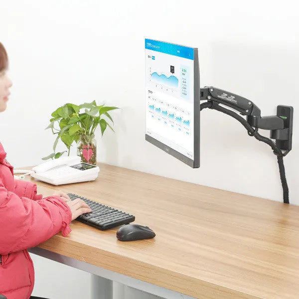 Black wall-mounted adjustable monitor stand with extending arm for computer screens.