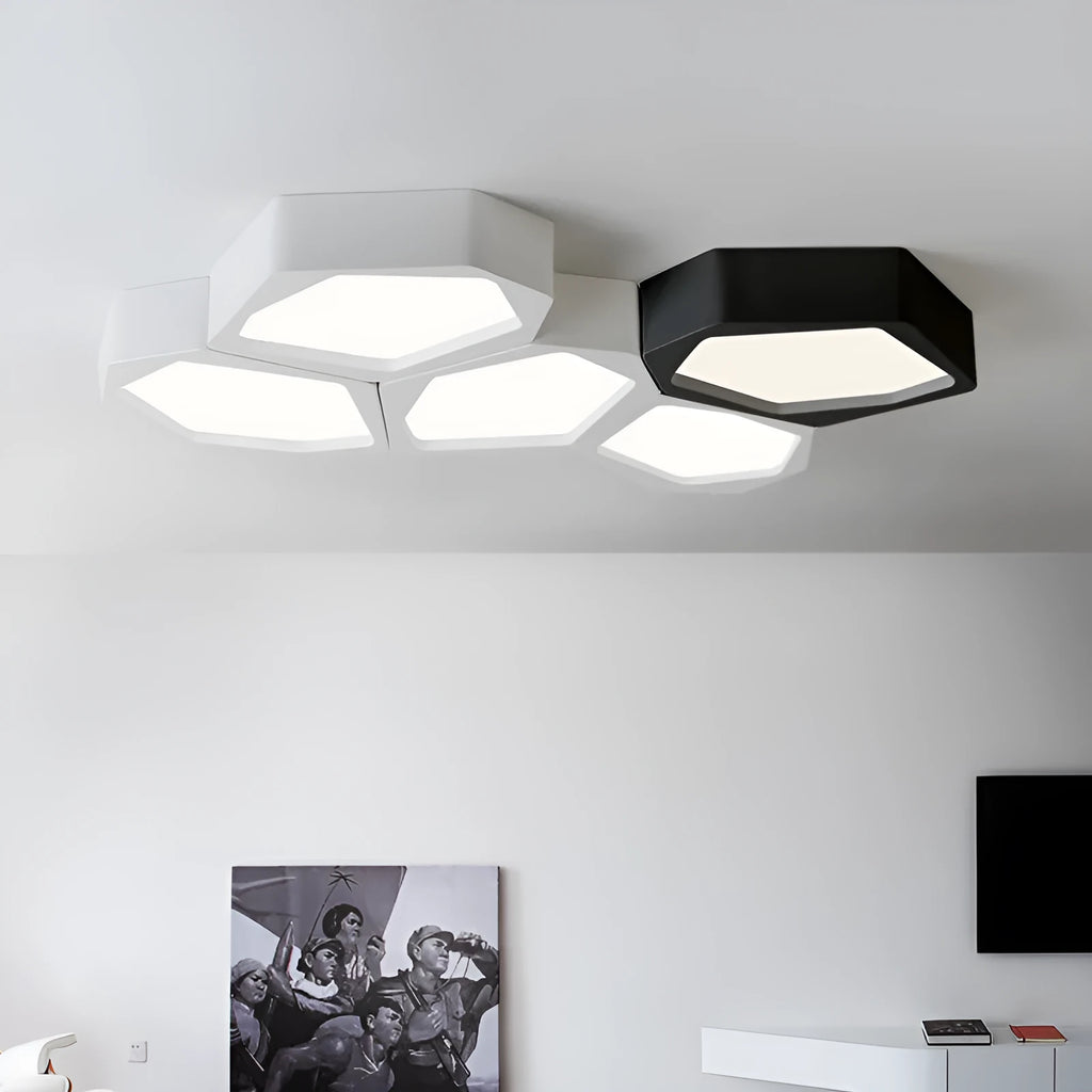 Geometric shaped iron LED light with remote control on a side table.