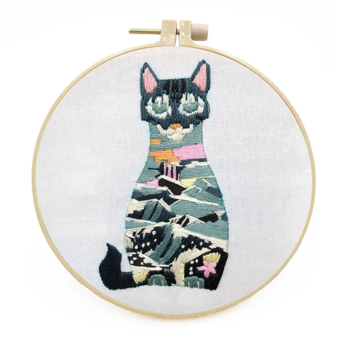 Beginners DIY cross stitch kit with cat design, embroidery threads, and fabric on a 15cm hoop.