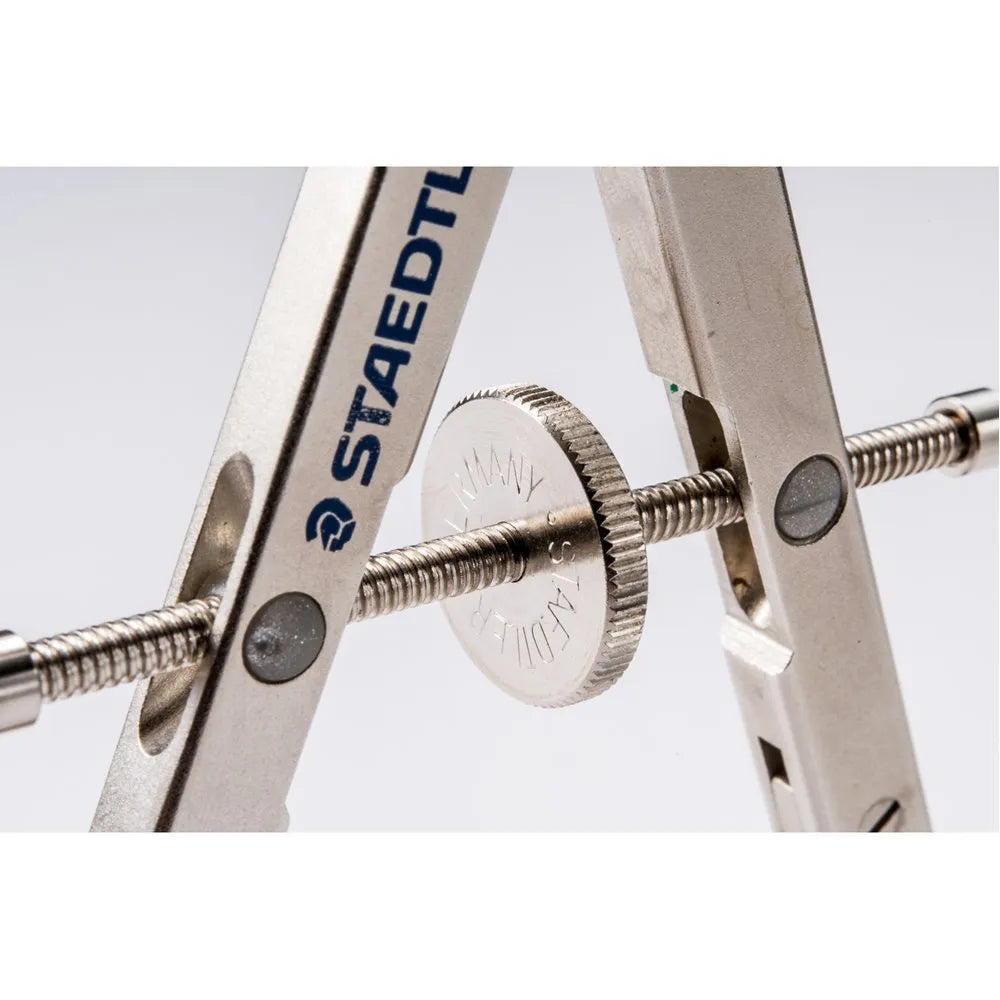 STAEDTLER 551 01 steel precision car compass with telescopic rod extended on technical drawing.