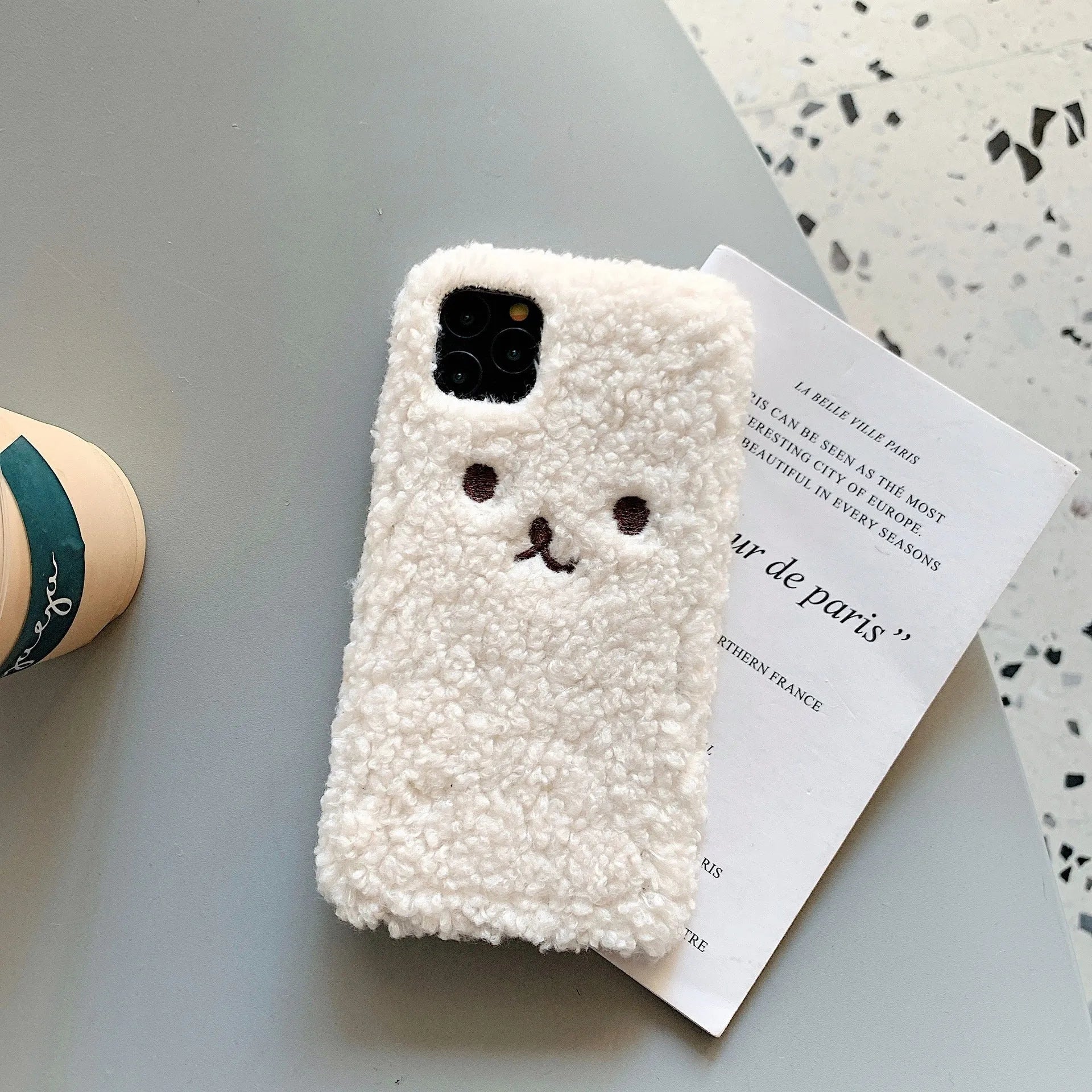 Brown embroidery plush cartoon bear iPhone case showing TPU construction and precise port cutouts