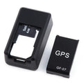 Small black plastic magnetic GPS tracker device with USB charging cable.