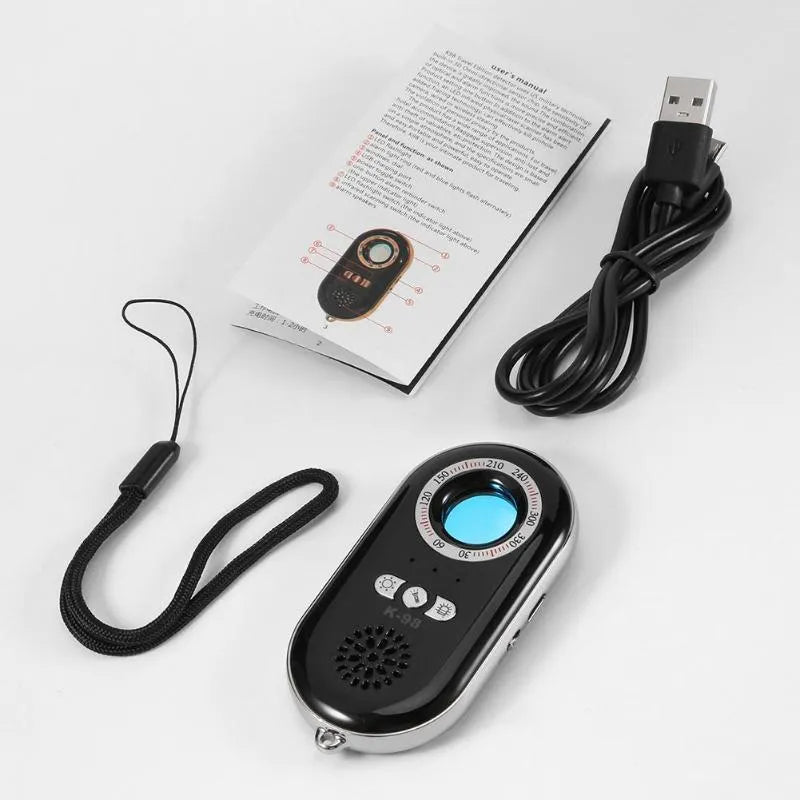 Small black wireless signal detector with vibration alarm for travel security, shown next to a ruler showing 85mm length.
