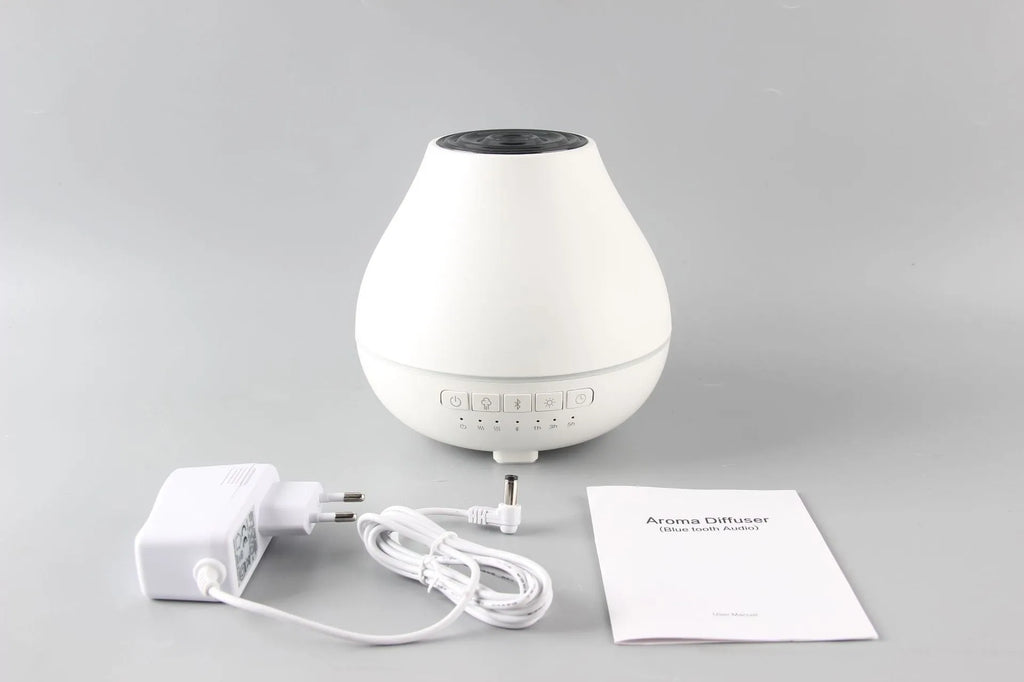 White round Bluetooth humidifier and aroma diffuser unit with built-in speaker and night light