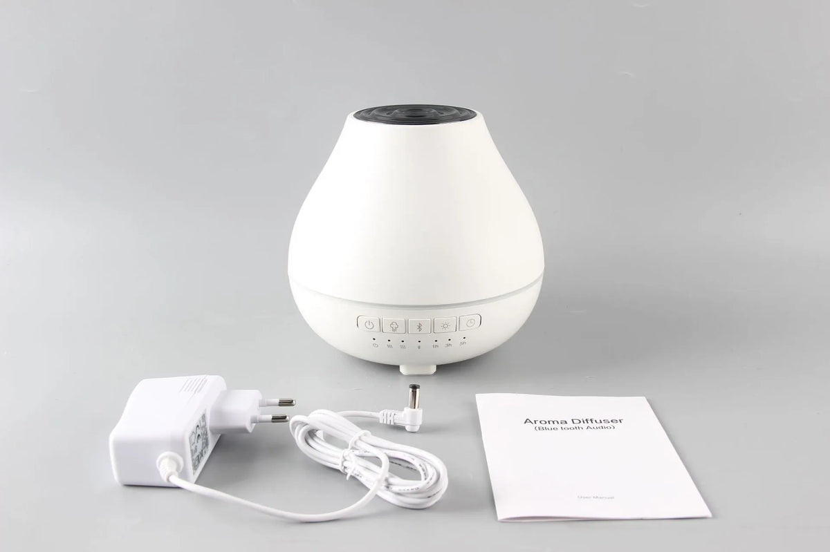 White round Bluetooth humidifier and aroma diffuser unit with built-in speaker and night light