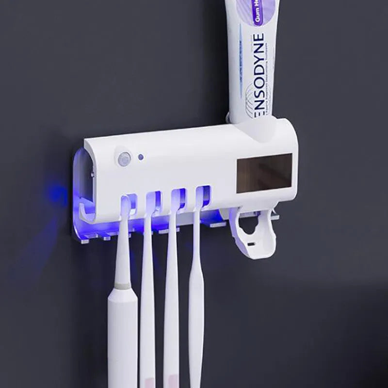 Black wall-mounted toothbrush steriliser with UV light and automatic toothpaste squeezer