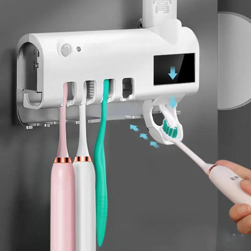 Black wall-mounted toothbrush steriliser with UV light and automatic toothpaste squeezer