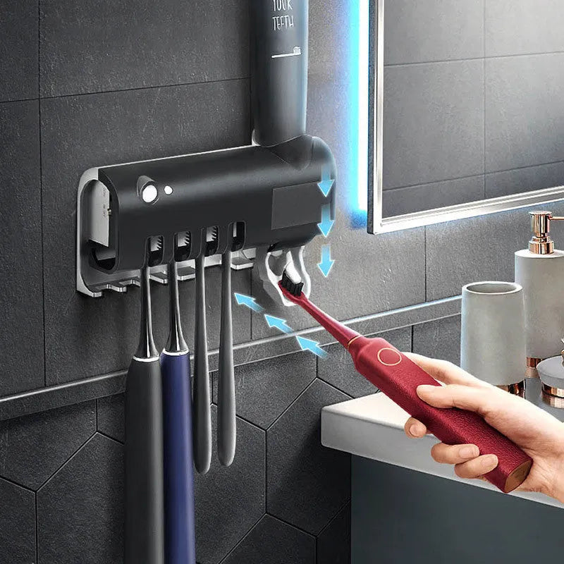 Black wall-mounted toothbrush steriliser with UV light and automatic toothpaste squeezer