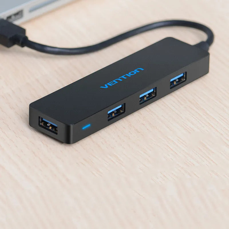 Black four-port USB 3.0 hub with short cable and nickel-plated connectors