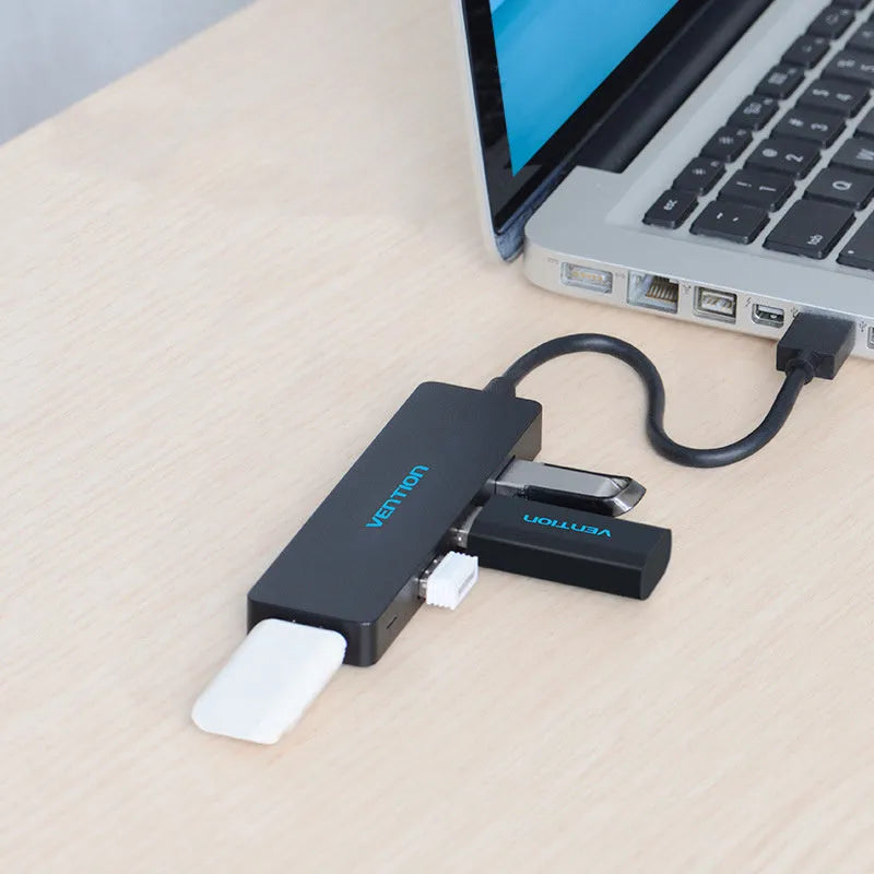 Black four-port USB 3.0 hub with short cable and nickel-plated connectors