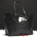 Women's cowhide leather shoulder bag in silver, shown with a single strap.