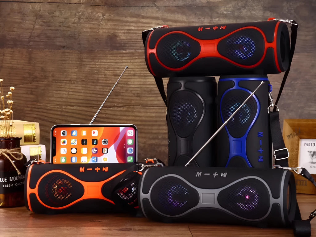 Portable Bluetooth speaker with integrated mobile phone stand and carrying strap in five colour options