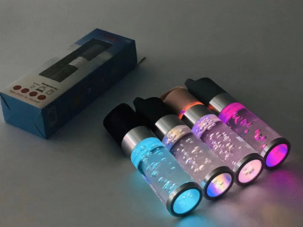 Portable Bluetooth speaker with colourful crystal lighting effect in pink finish showing compact rectangular design