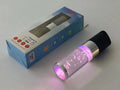 Portable Bluetooth speaker with colourful crystal lighting effect in pink finish showing compact rectangular design