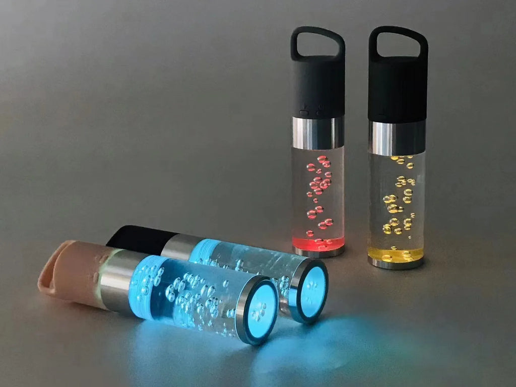 Portable Bluetooth speaker with colourful crystal lighting effect in pink finish showing compact rectangular design