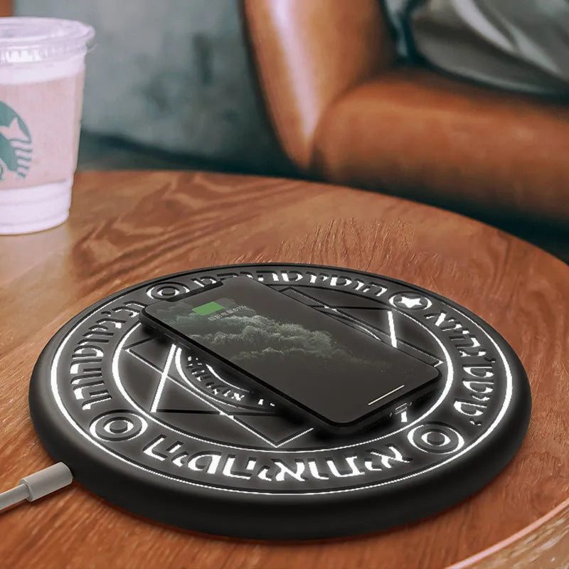 Square wireless charger with glowing magic array pattern design on desk
