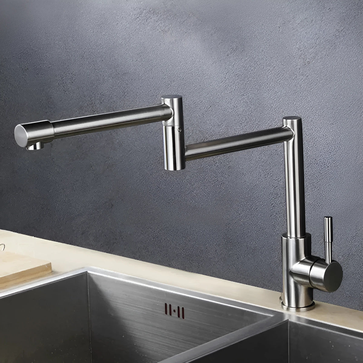 Silver stainless steel kitchen mixer tap with rotating spout and lifting handle