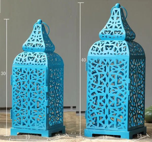 Blue Moroccan geometric iron candelabra with hollow retro design for candle display.