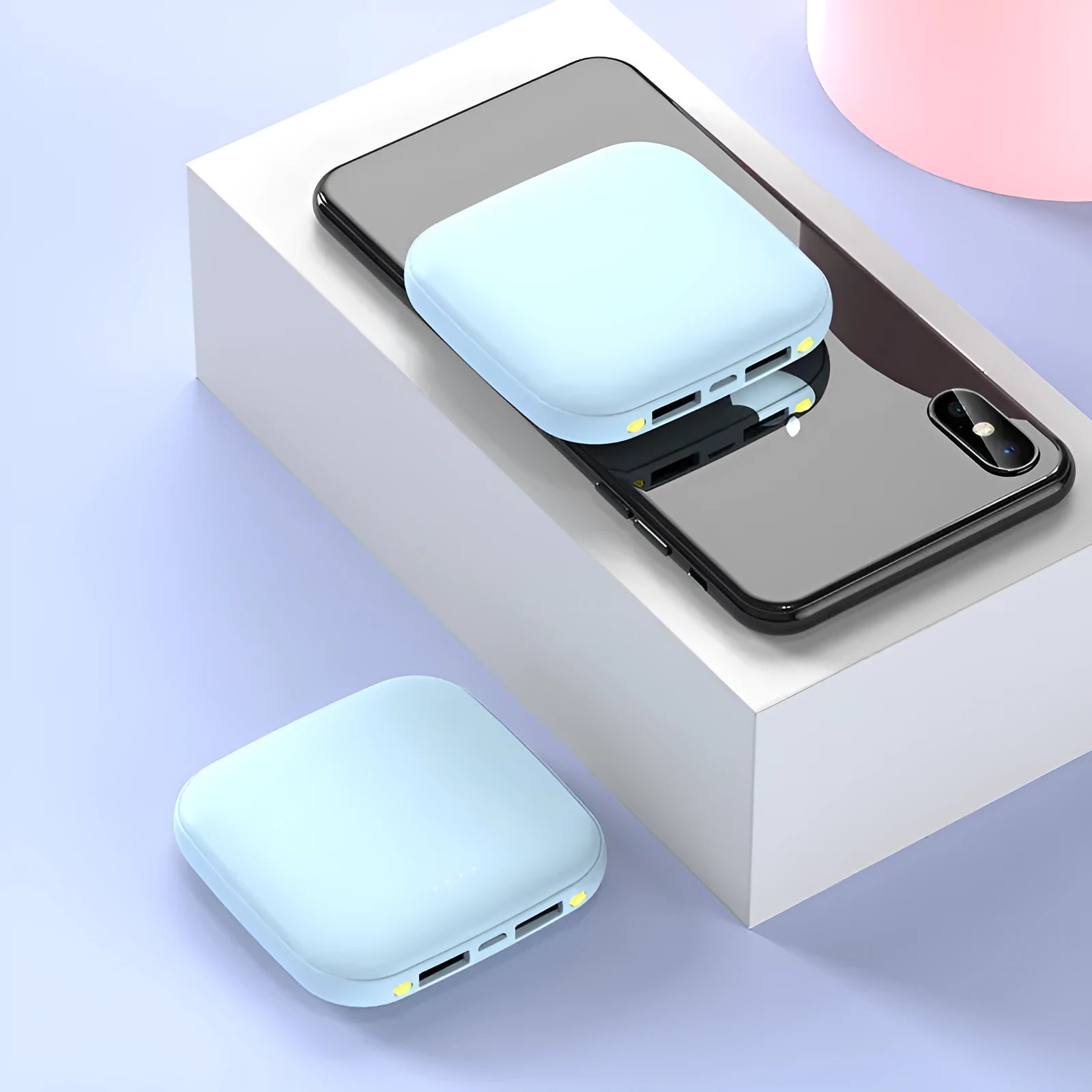 Square black mini power bank showing size scale with built-in LED flashlight and USB port