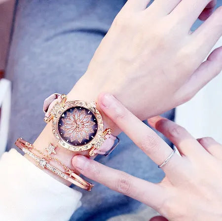 Full diamond bezel ladies watch with round dial on wrist, showing colour options and pin buckle clasp.