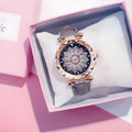 Full diamond bezel ladies watch with round dial on wrist, showing colour options and pin buckle clasp.