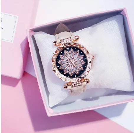 Full diamond bezel ladies watch with round dial on wrist, showing colour options and pin buckle clasp.