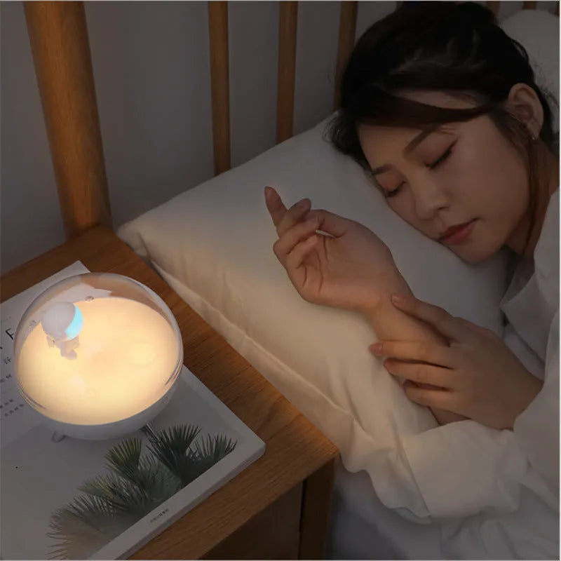 USB-powered cartoon guardian LED night light with modern design on wooden surface