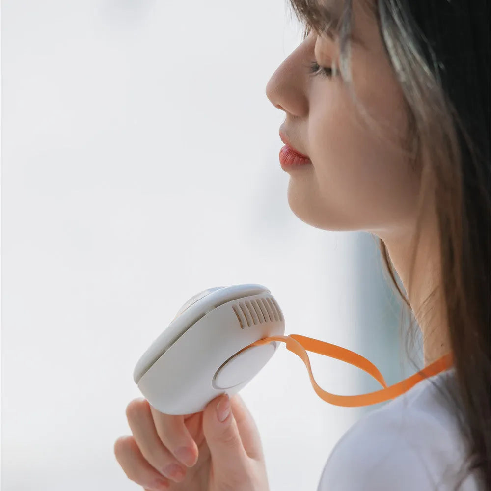 White hanging neck USB fan with 3 speed buttons shown in hand and around neck.
