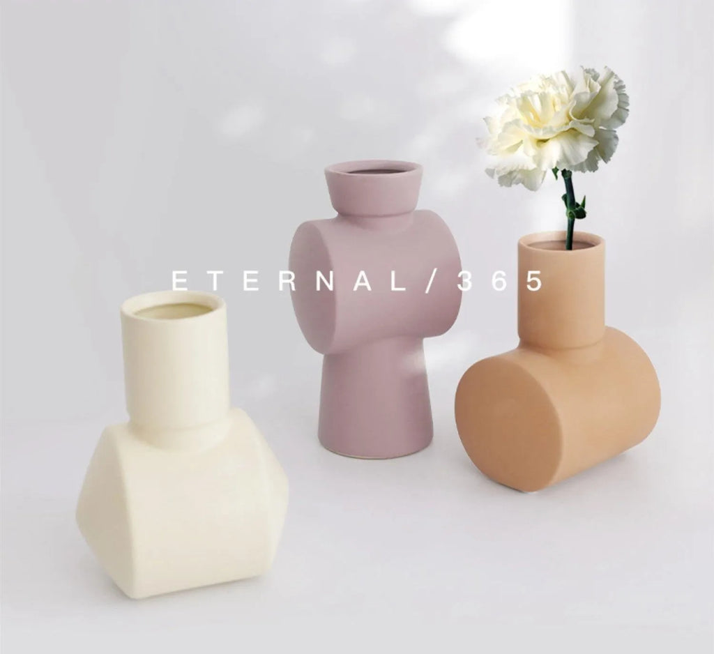 Nordic style hammer-finish ceramic vase in Morandi colours on wooden surface