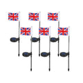 Solar garden flag light with stainless steel pole showing American flag design illuminated at night