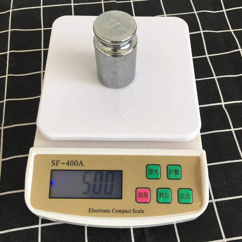 SF-400A black electronic kitchen scale on a countertop showing a 10kg weight reading