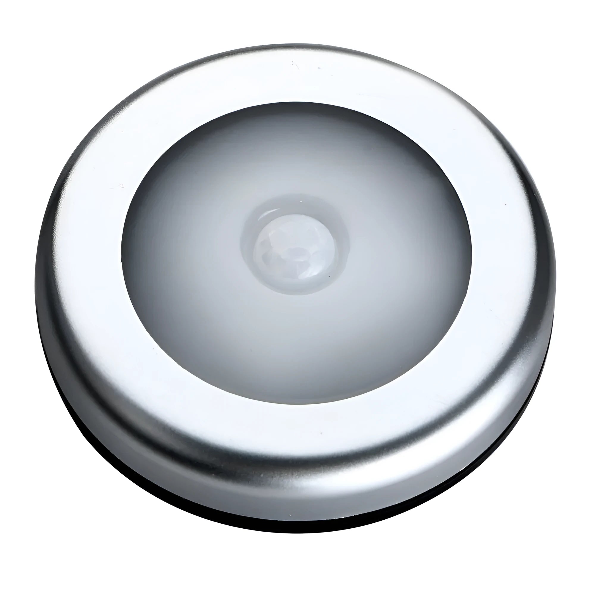 Silver-coloured circular wireless motion sensor night light on a surface