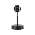 Black USB dual-head sunset rainbow projection lamp with touch controls on bedside table