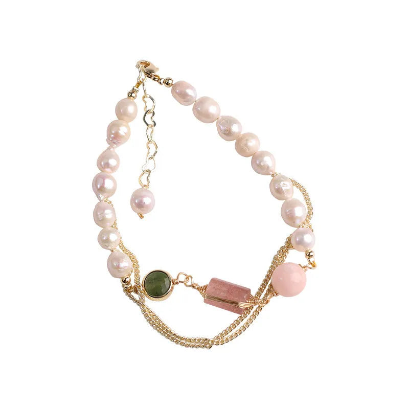 Women's pink freshwater pearl bracelet with geometric strawberry crystal pendant on individual packaging